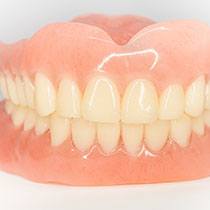 Pair of dentures sitting on a table