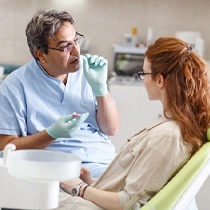 dentist explaining dental implants to a patient