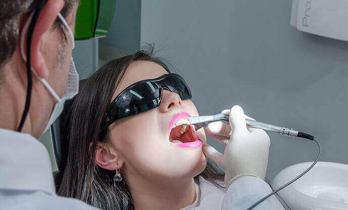 Patient wearing sunglasses getting examined