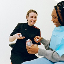 Dentist discussing dental crown with patient