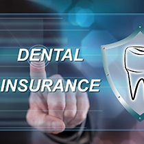 Fingertip on dental insurance screen